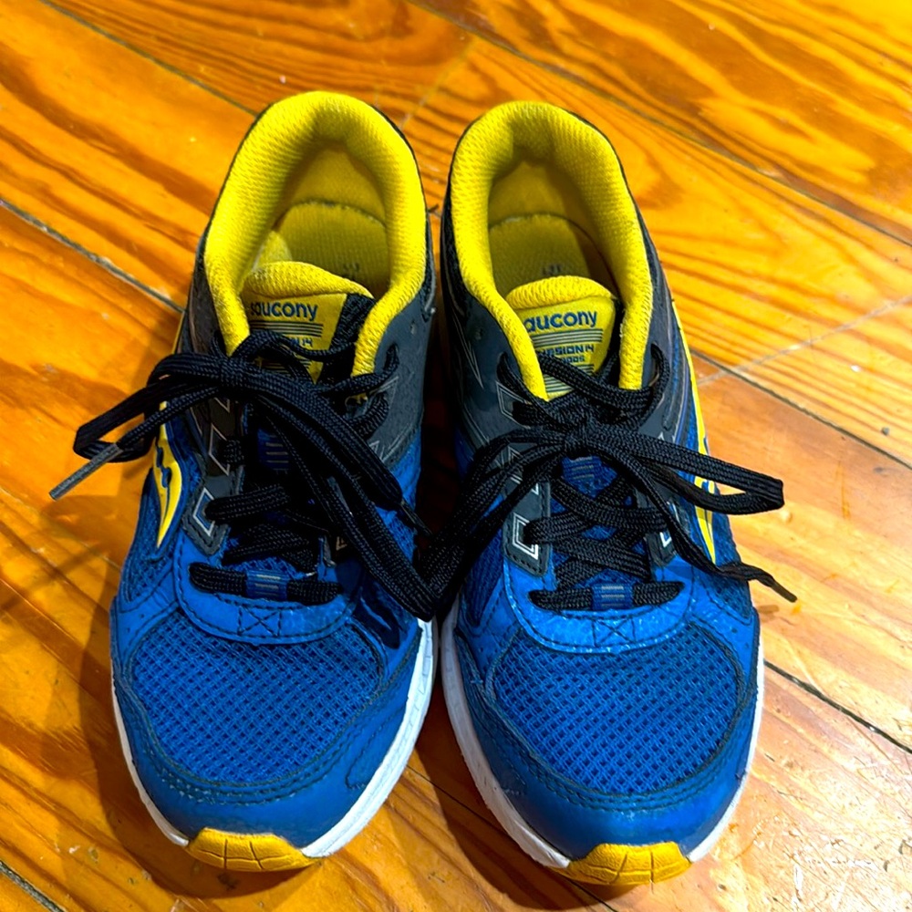 Kids blue and yellow low Saucony sneakers size 13.5